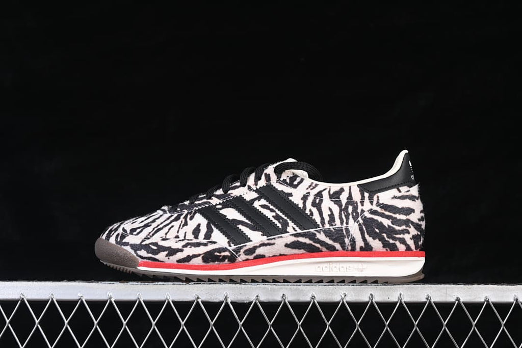 Opposite side view of the animal-print adidas SL 72 OG sneaker with black stripes and a white midsole.