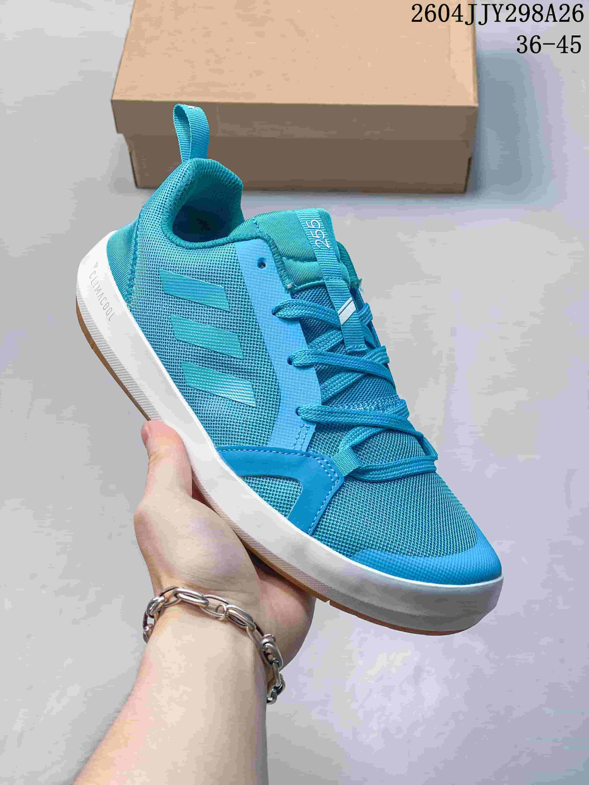 Angled side view of a turquoise Adidas Terrex Boat shoe