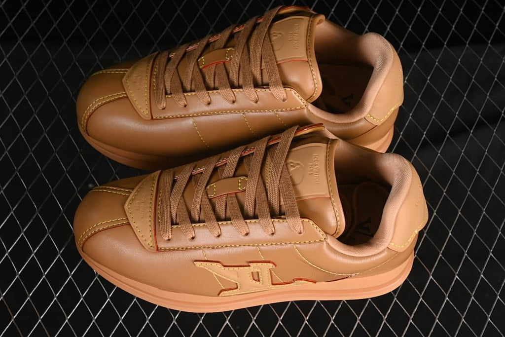 Pair of brown low-top sneakers shown from above