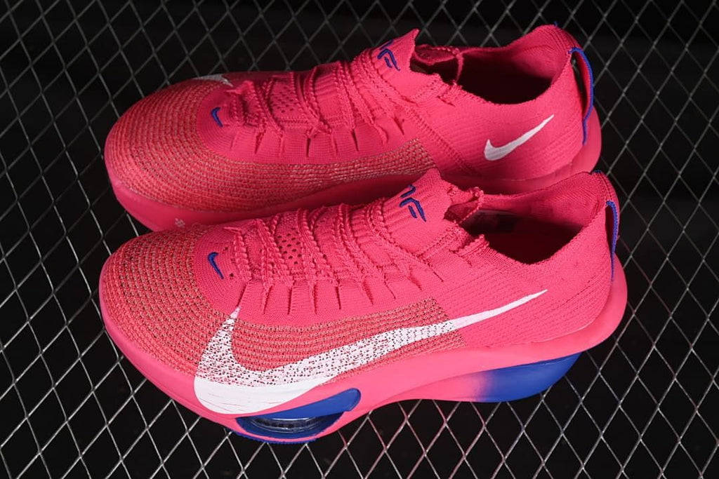 Pair of pink and blue Nike running shoes shown from above and the side.
