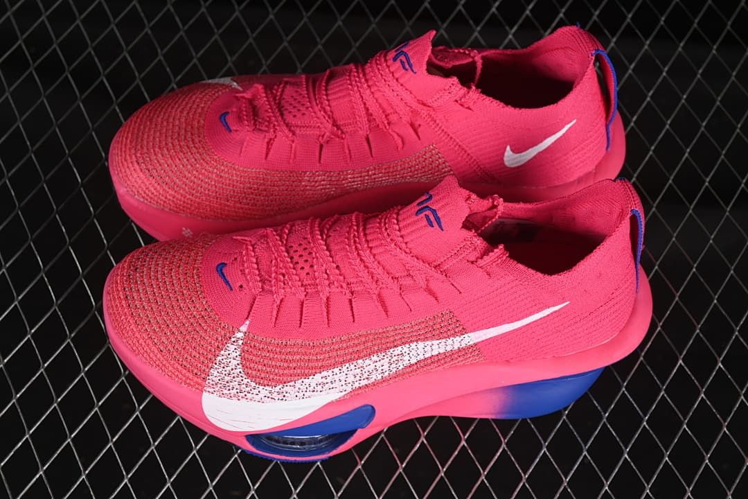 Pair of pink and blue Nike running shoes shown from above and the side.