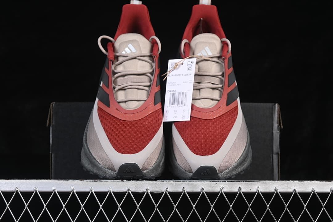 Front view of the pair with red toe panels and gray laces