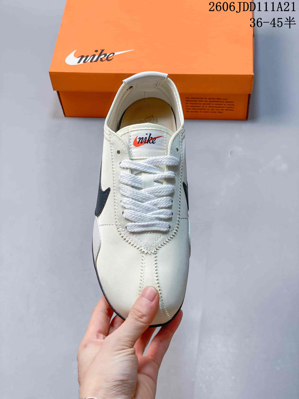 Top view of an off-white Nike Moon Shoe OG Summit sneaker with white laces and stitched panels