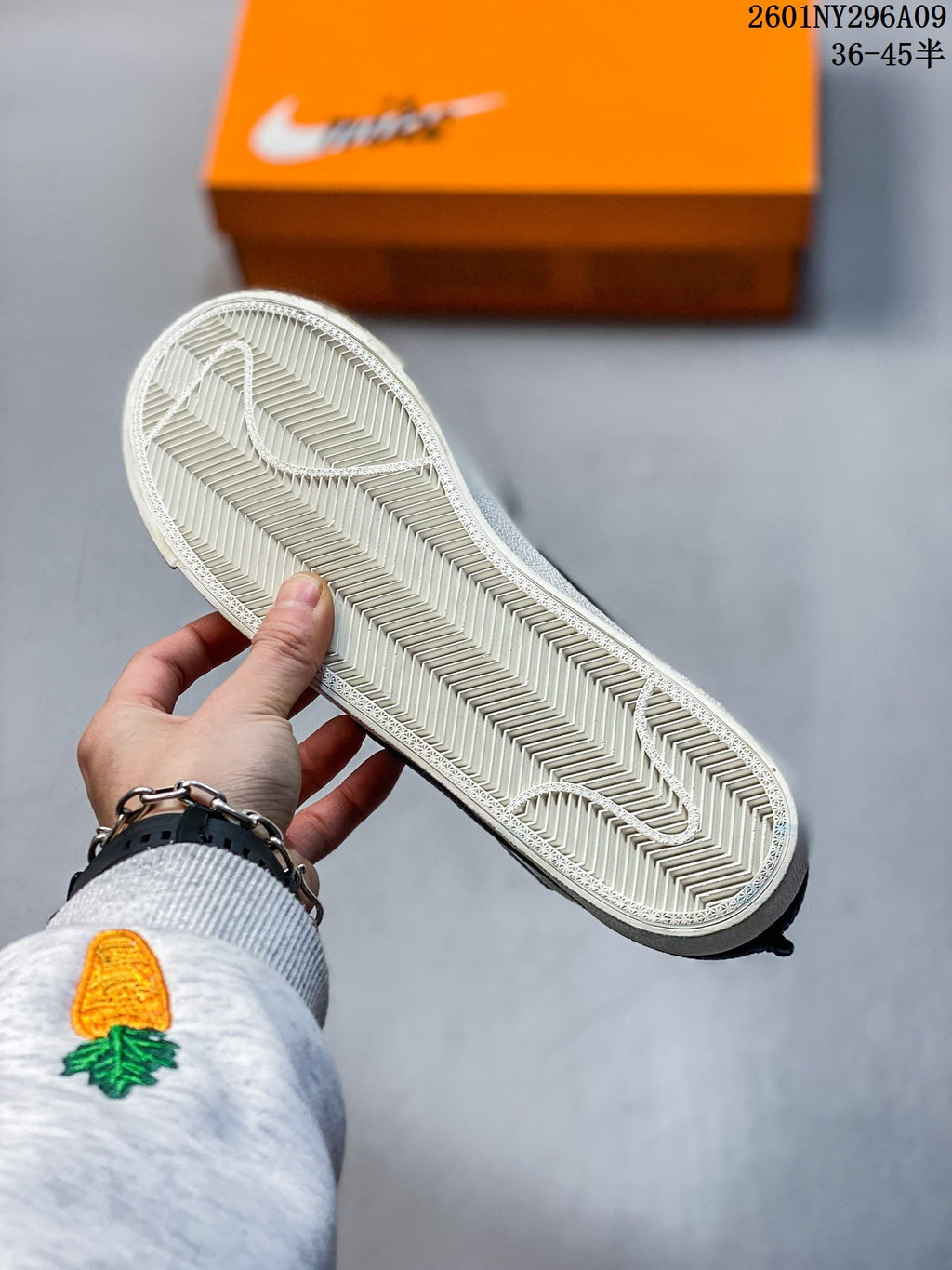 Underside of the sneaker showing a light-colored herringbone-pattern outsole