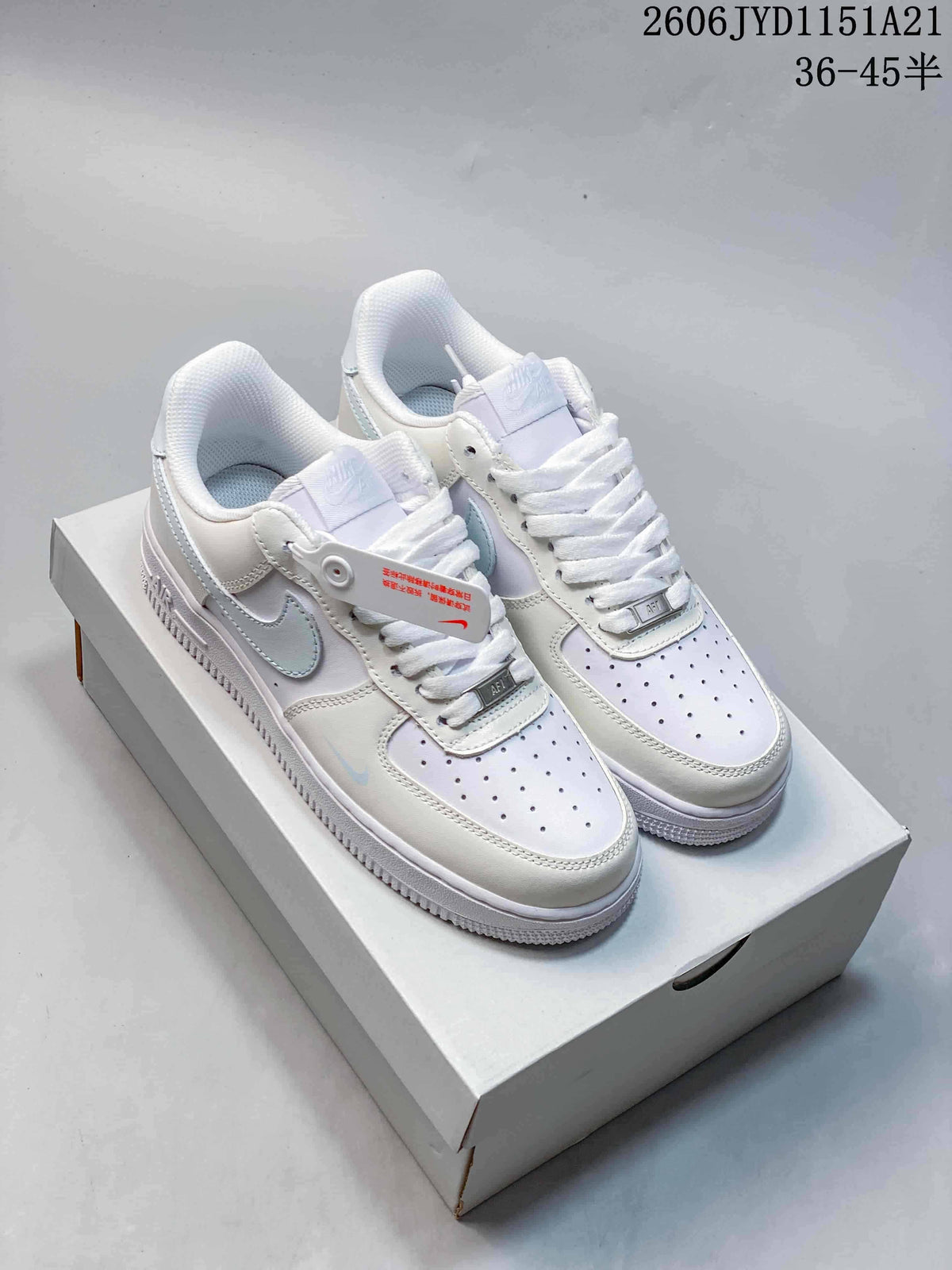 Pair of white and light gray low-top sneakers shown from above