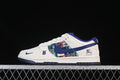 Side view of a white and blue low-top sneaker with a multicolored patterned panel and branded details.