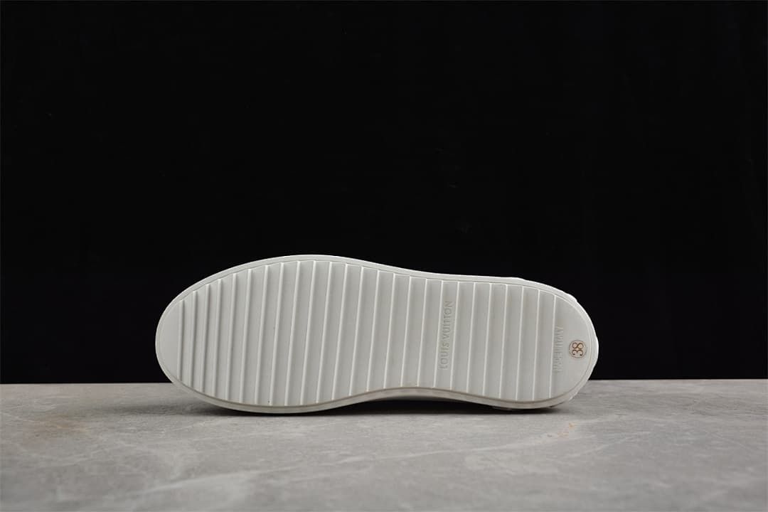 Underside showing the outsole grooves and a size 38 marking
