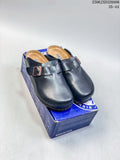 Pair of black closed-toe buckle clogs displayed on a blue shoe box; size range 35–44 is printed in the image.