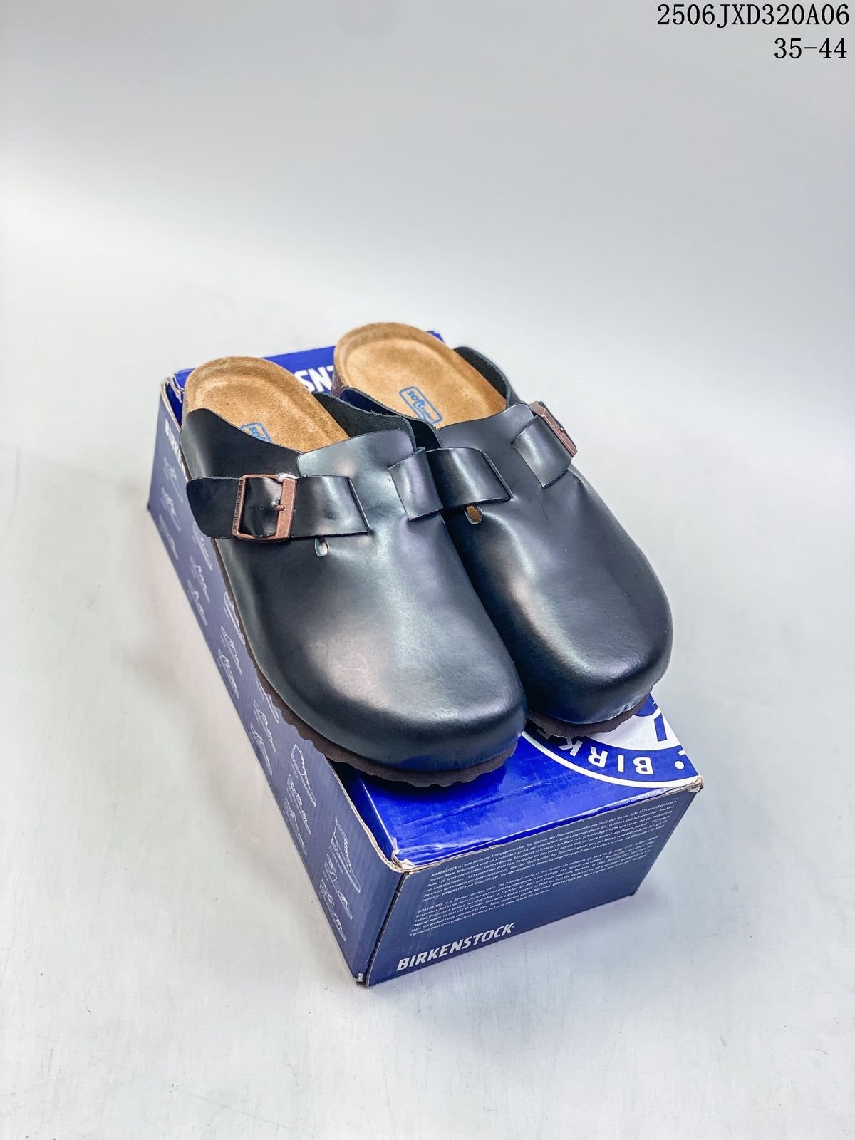 Pair of black closed-toe buckle clogs displayed on a blue shoe box; size range 35–44 is printed in the image.