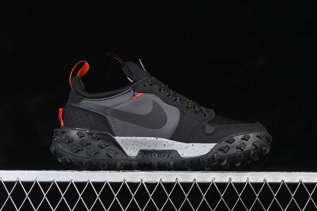 Opposite side profile showing the Swoosh, orange details, and lugged outsole