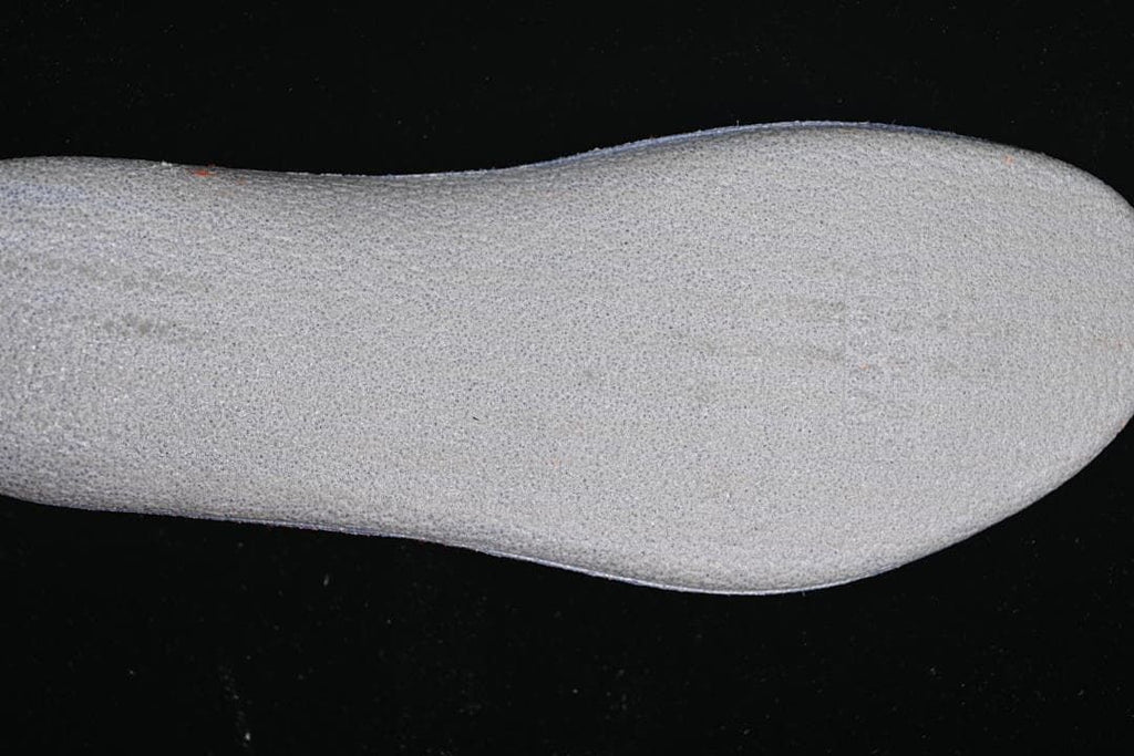 Close-up of a light-colored shoe component
