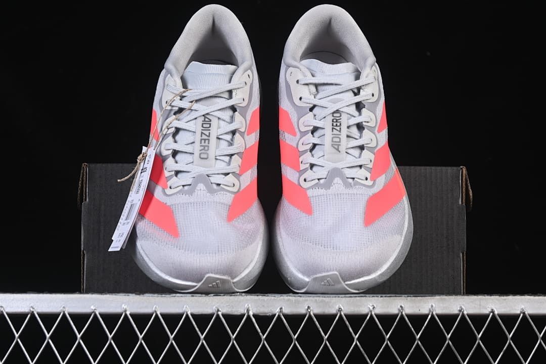 Front view of the pair with coral stripes and lace-up closures