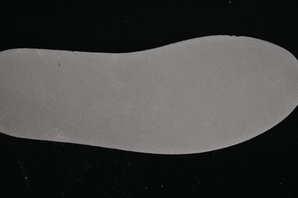 Close-up of a light-colored shoe insole.