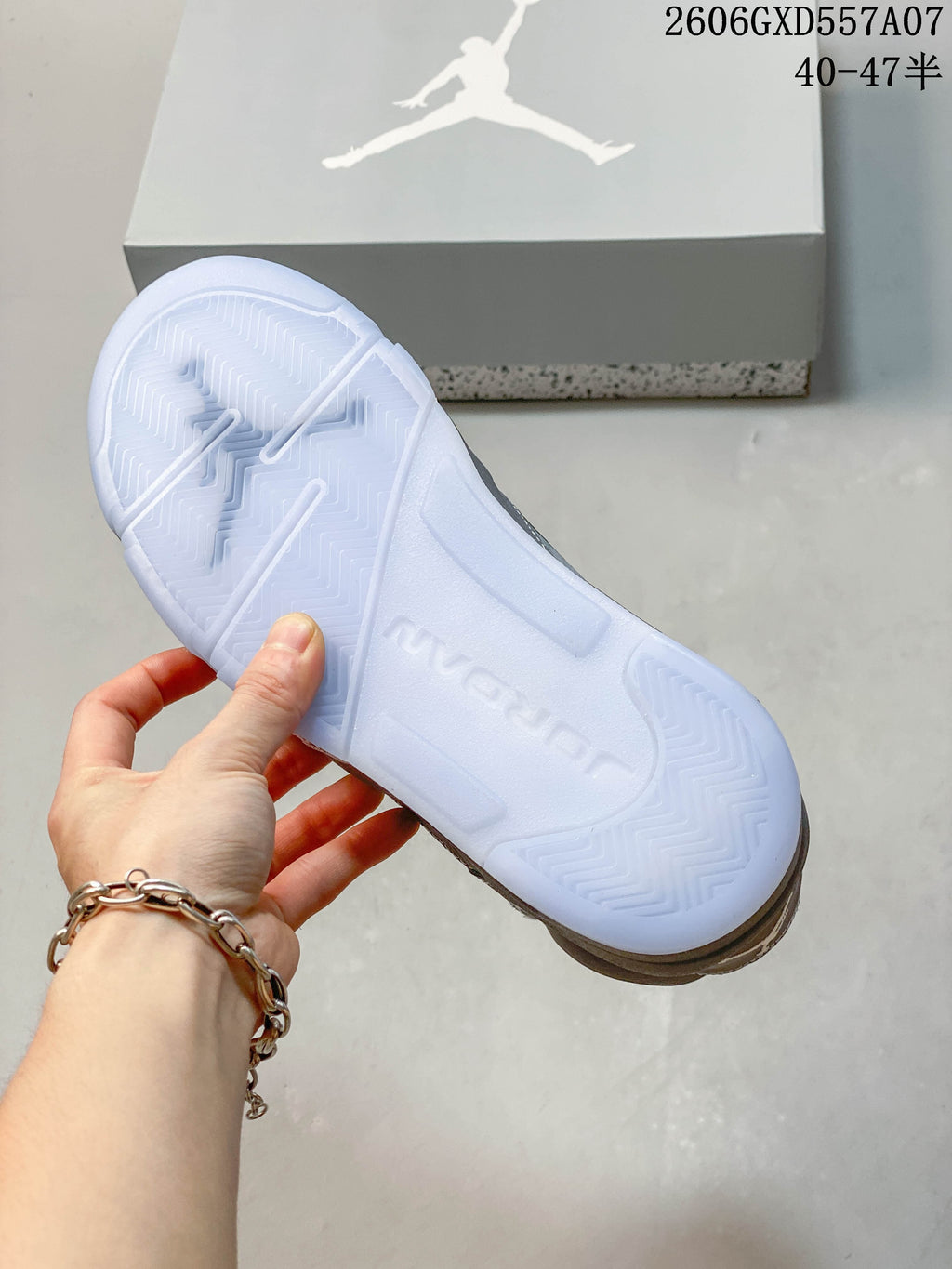 Close-up of the sneaker outsole and Jordan-branded shoe box