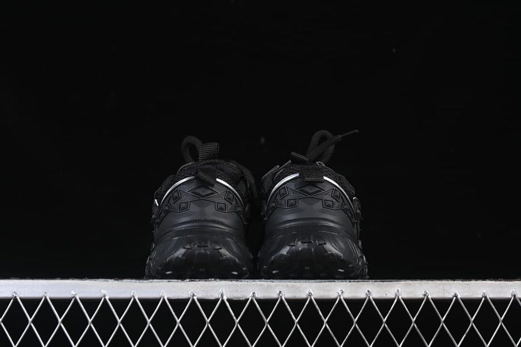 Rear view of the pair showing the heel details and chunky soles.