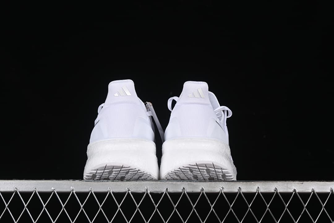 Rear view of the pair showing the heel counters and outsole edges.