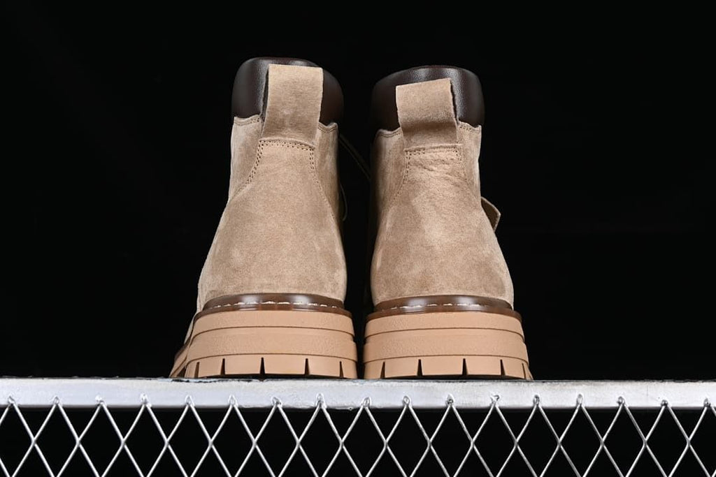 Rear view of the pair showing heel panels, pull tabs, and layered soles.