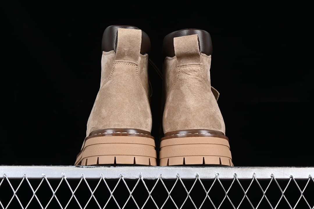 Rear view of the pair showing heel panels, pull tabs, and layered soles.