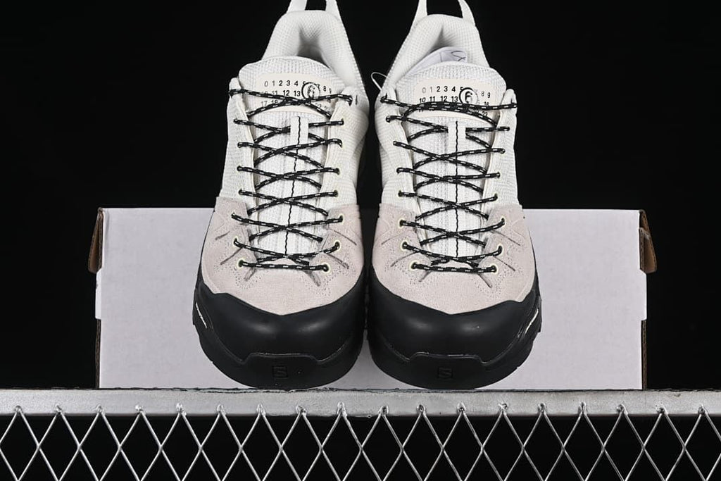 Front view of the pair showing black toe overlays and lace-up fronts