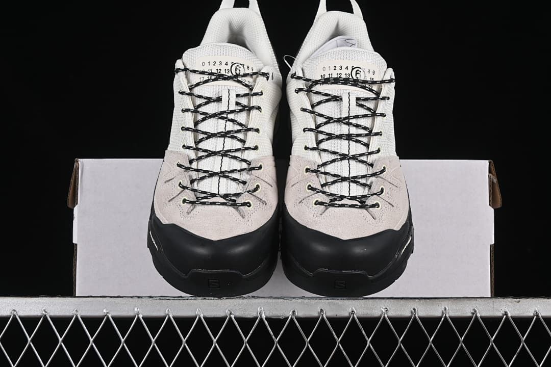 Front view of the pair showing black toe overlays and lace-up fronts
