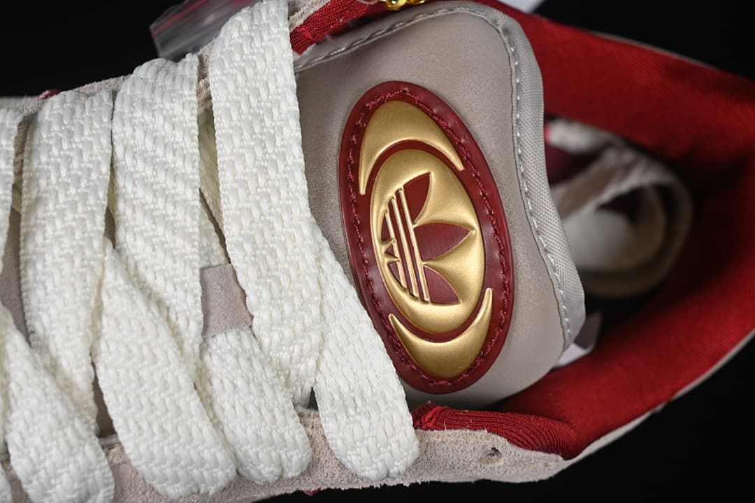 Close-up of tongue badge and wide white laces