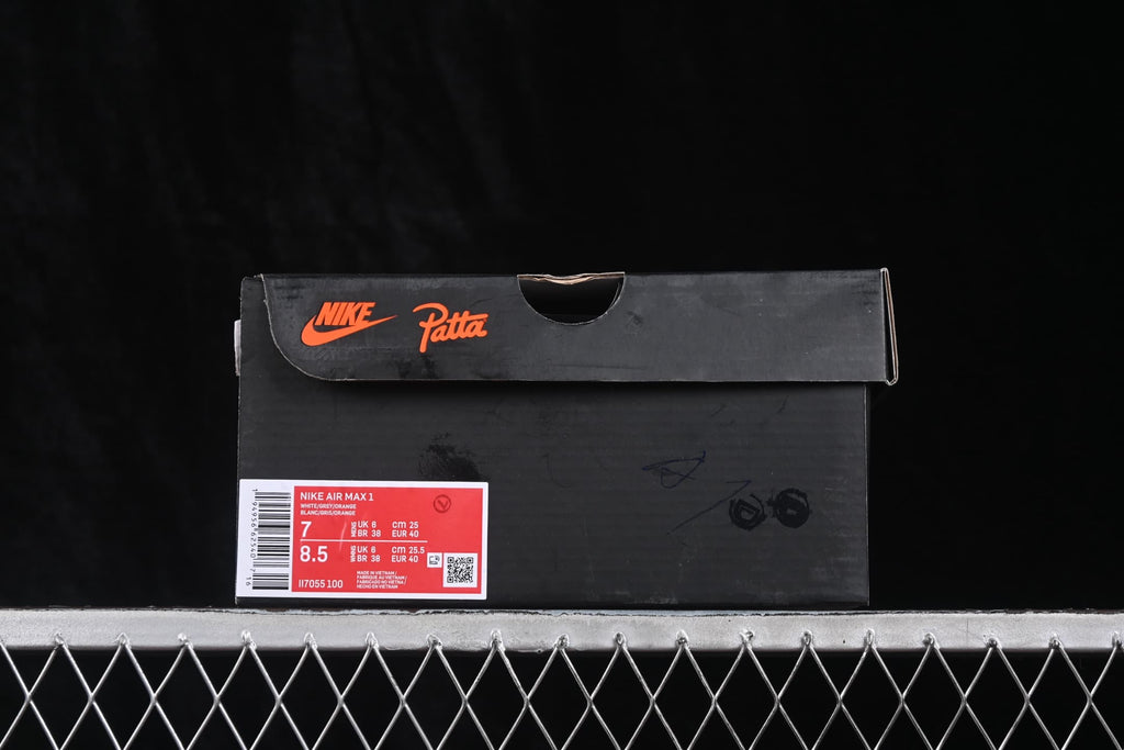 Black shoe box with Nike and Patta branding and a label showing Air Max 1, style code II7055-100, US sizes 7 and 8.5, and EU size 40.