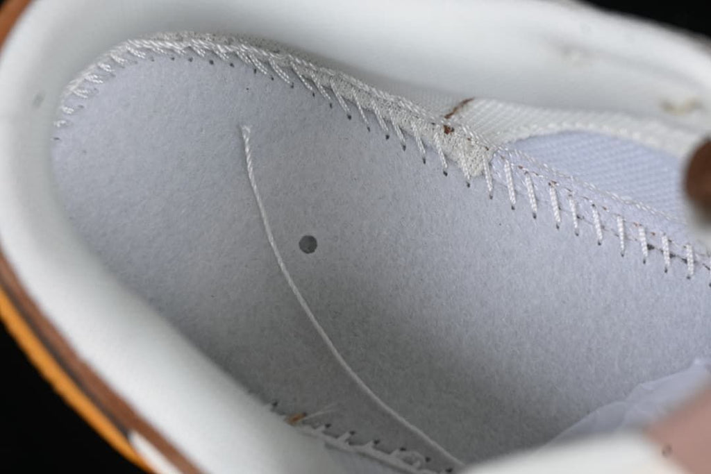 Close-up of the sneaker's light-colored interior stitching
