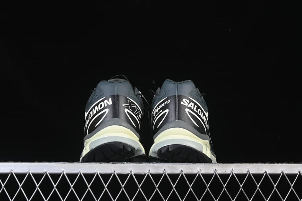 Rear view of the sneakers showing heel graphics and outsole tread.