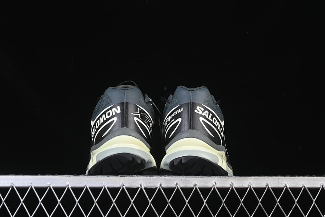Rear view of the sneakers showing heel graphics and outsole tread.