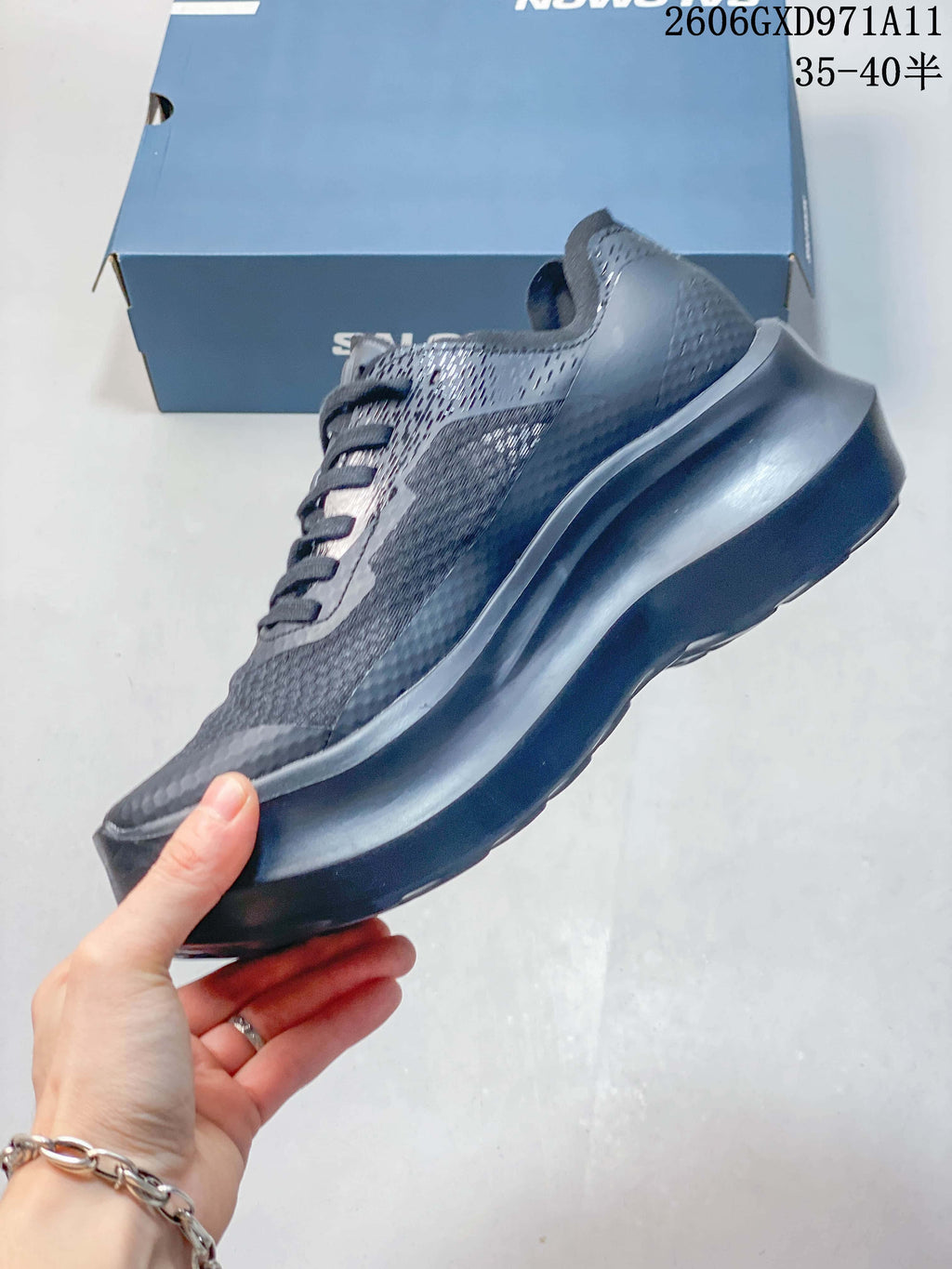 Side profile of a gray Salomon low-top sneaker with a sculpted sole