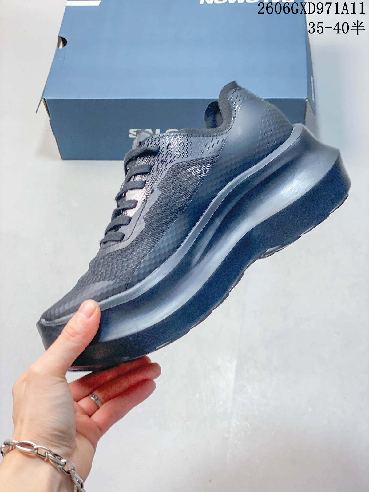 Side profile of a gray Salomon low-top sneaker with a sculpted sole