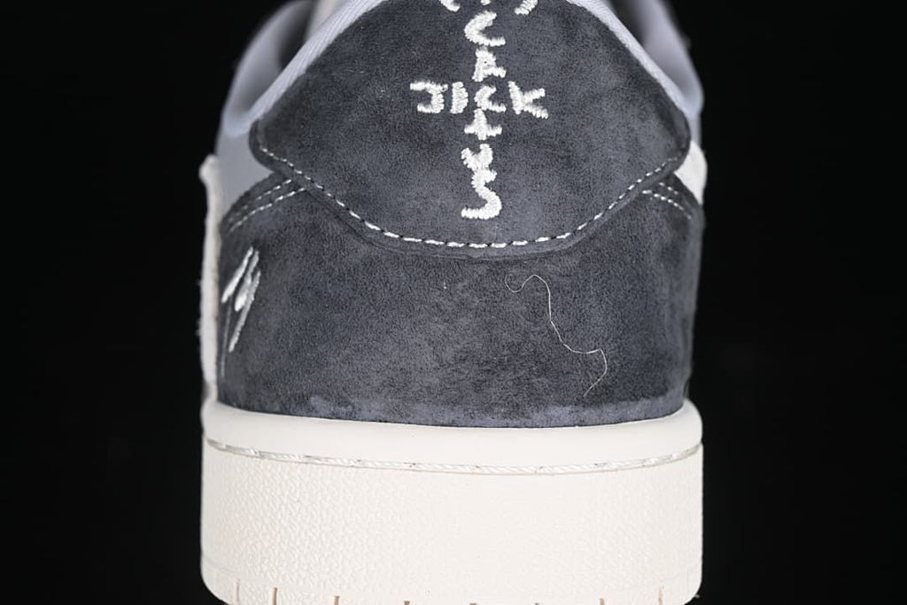 Rear view of the dark heel panel with embroidered detailing