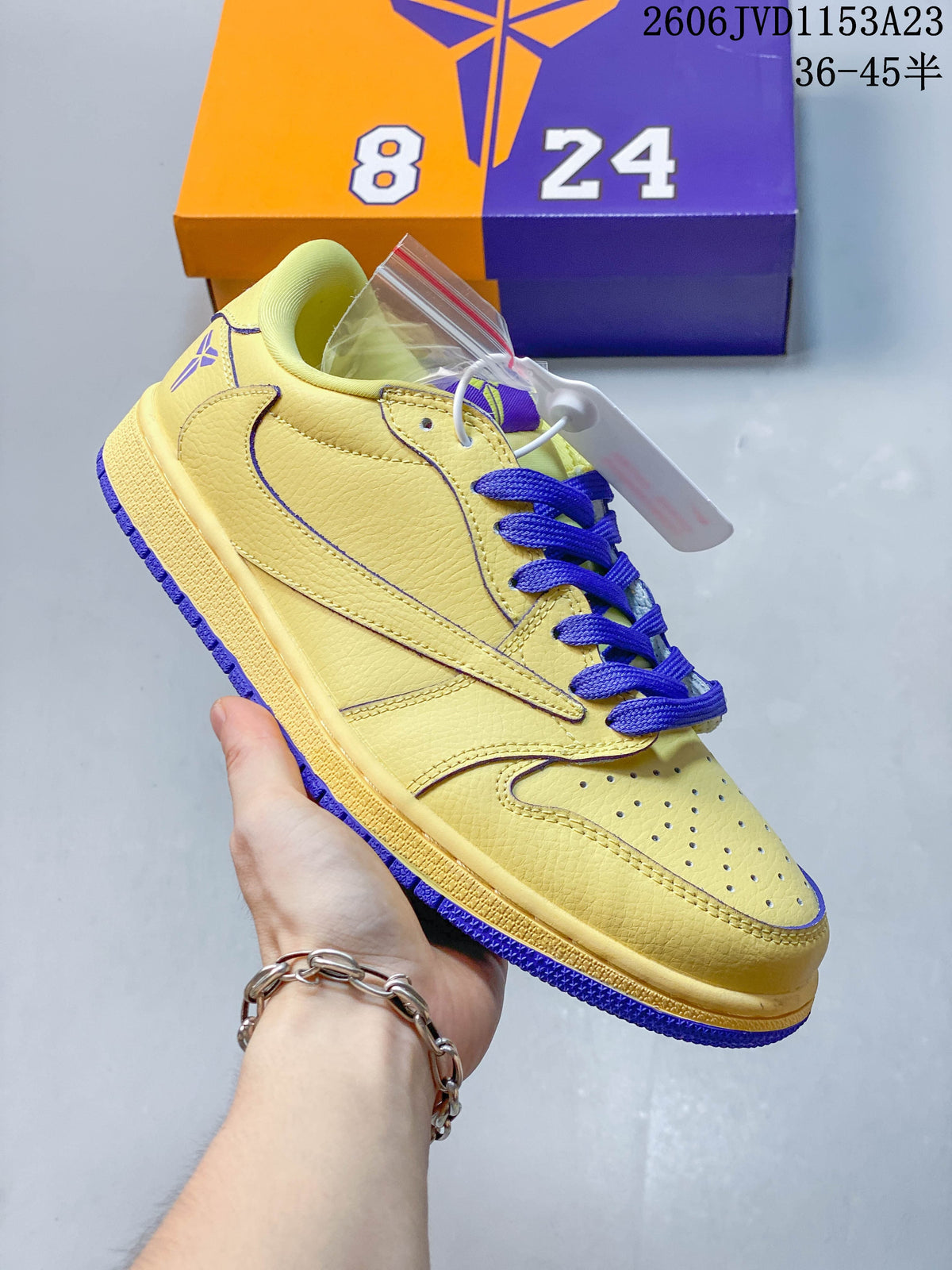 Angled side view showing the Swoosh and contrasting purple outsole
