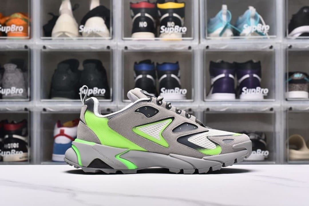 Outer side view highlighting the layered panels and green heel section