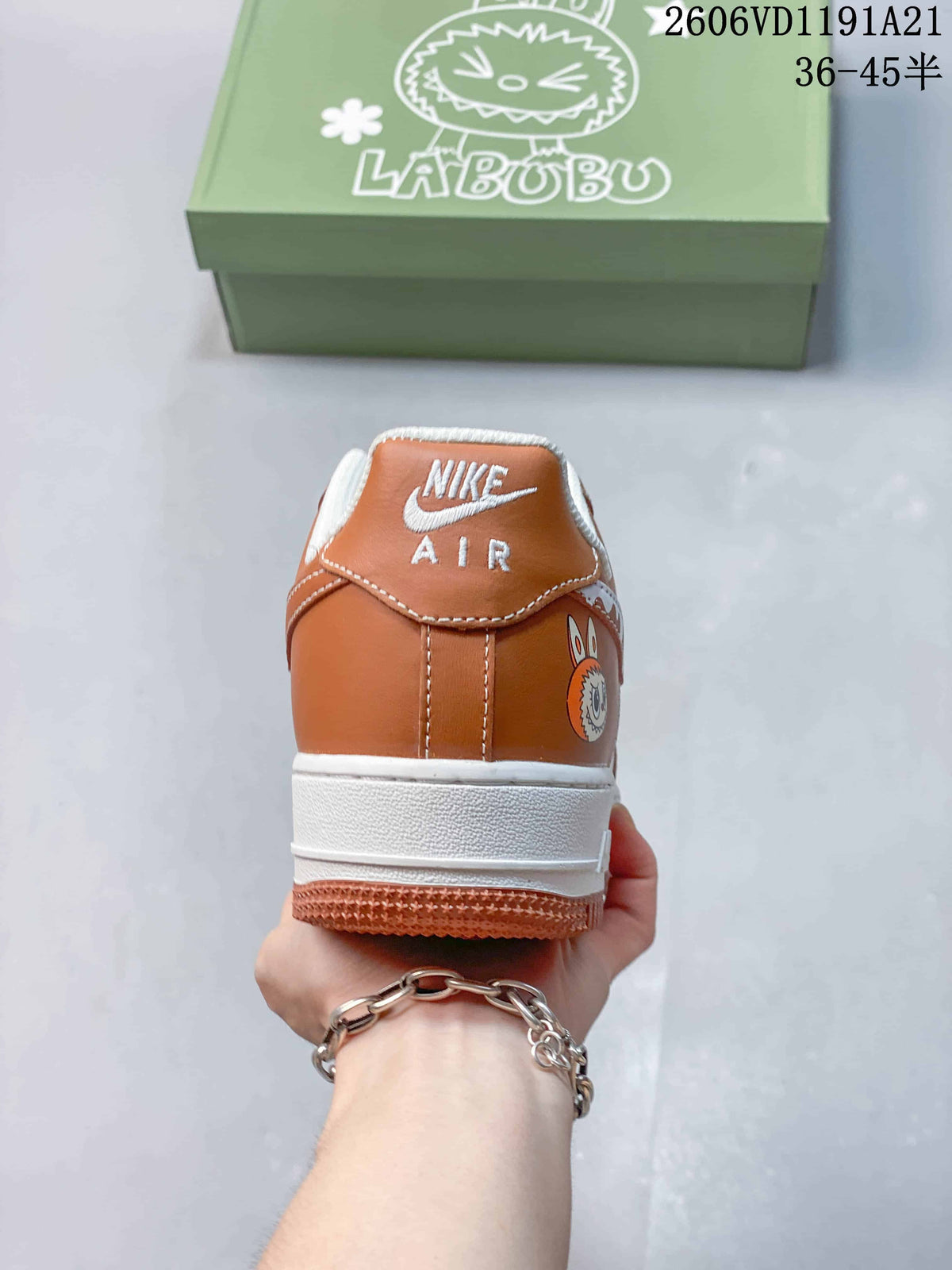 Rear view of brown-and-white sneaker with Nike Air branding and character graphic
