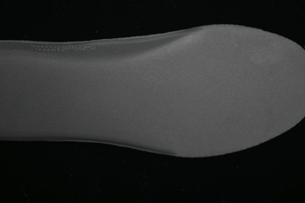 Close-up of a shoe insert with a printed size range marking