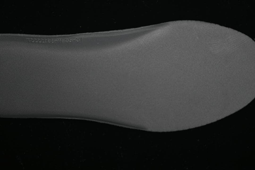 Close-up of a shoe insert with a printed size range marking