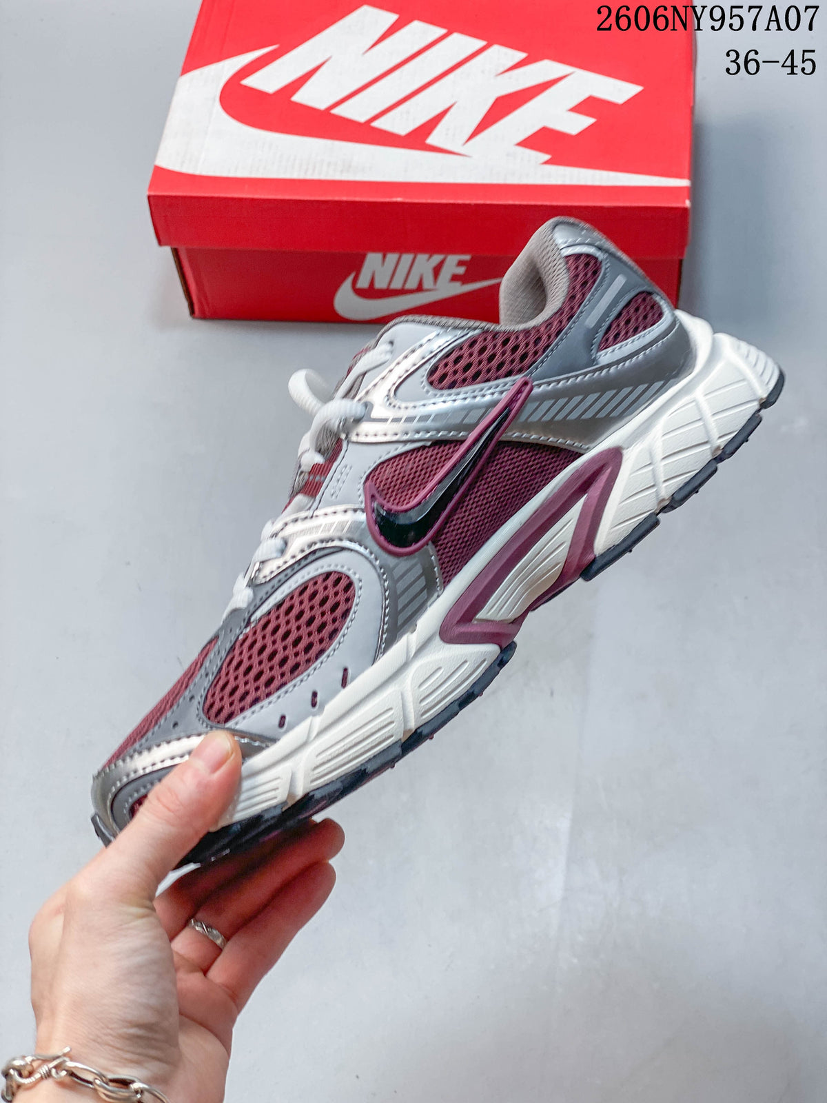 Side view of a burgundy and silver Nike V5 RNR sneaker.