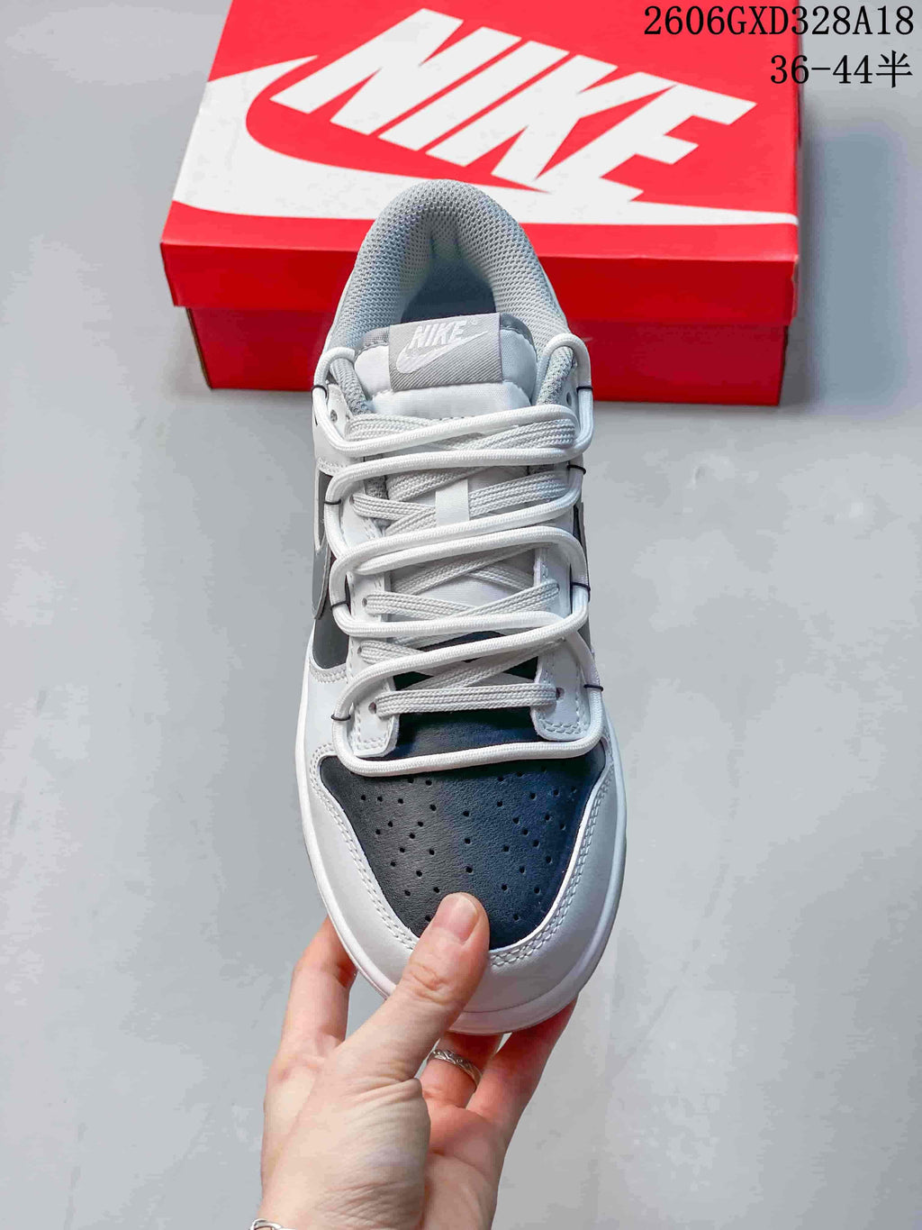 Front view of the sneaker showing its perforated toe and lacing
