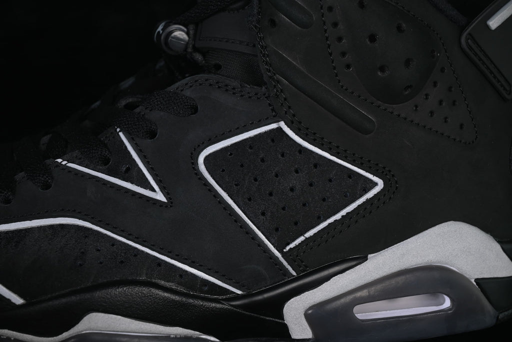 Detail of the perforated side panel, contrasting trim and heel cushioning window.