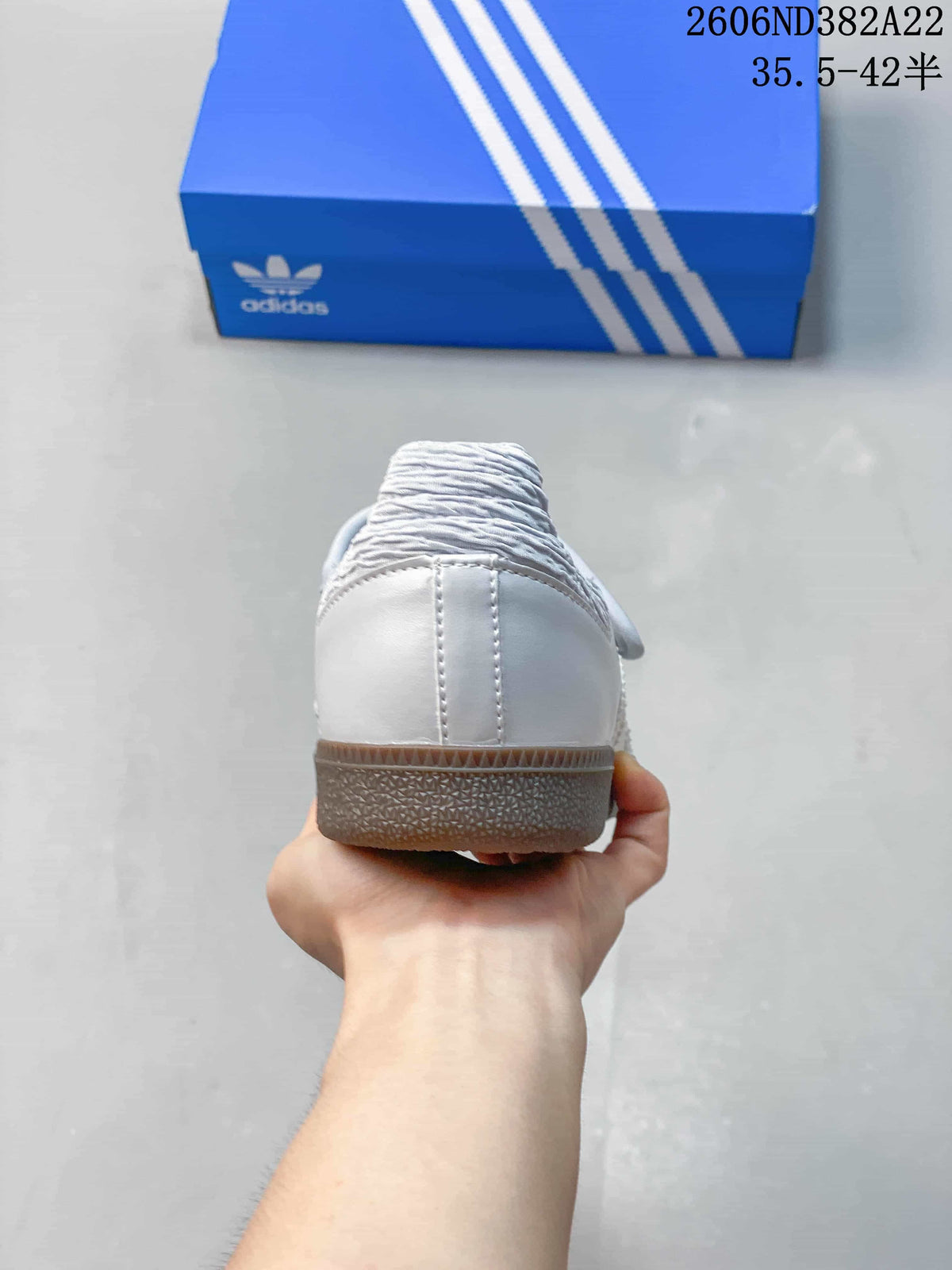 Rear view showing the heel and outsole of a pale Adidas Samba Jane sneaker.