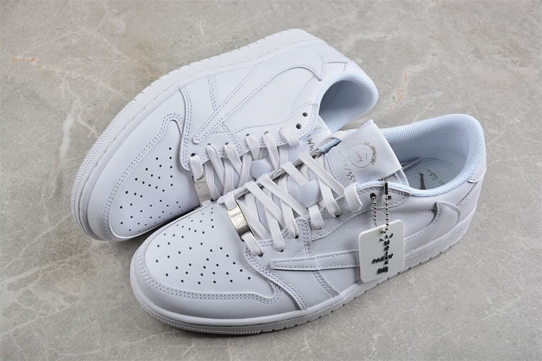 Pair of white low-top sneakers arranged together