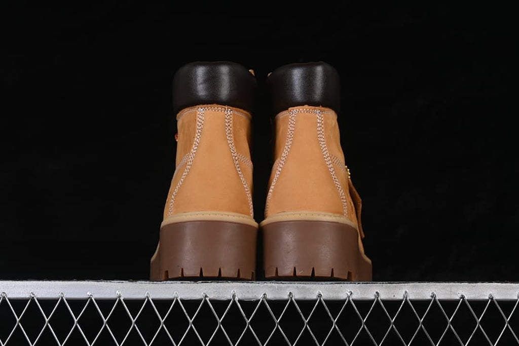 Rear view of the pair showing the stitched heels and dark collars