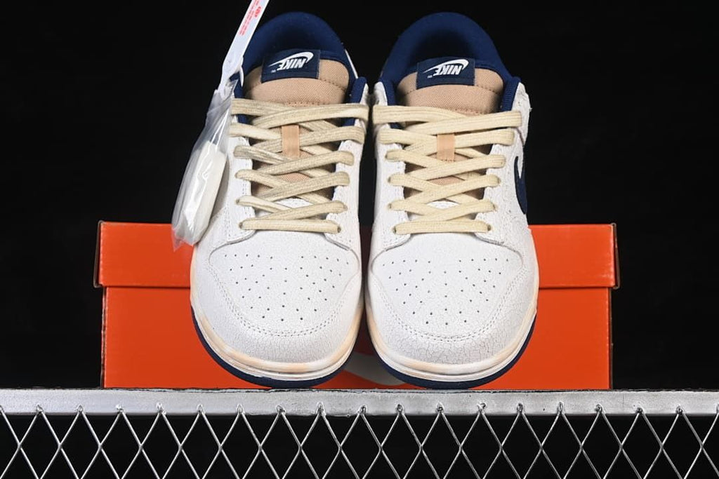 Front view of the pair with perforated toes and cream-colored laces