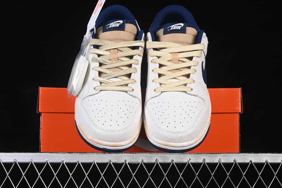 Front view of the pair with perforated toes and cream-colored laces