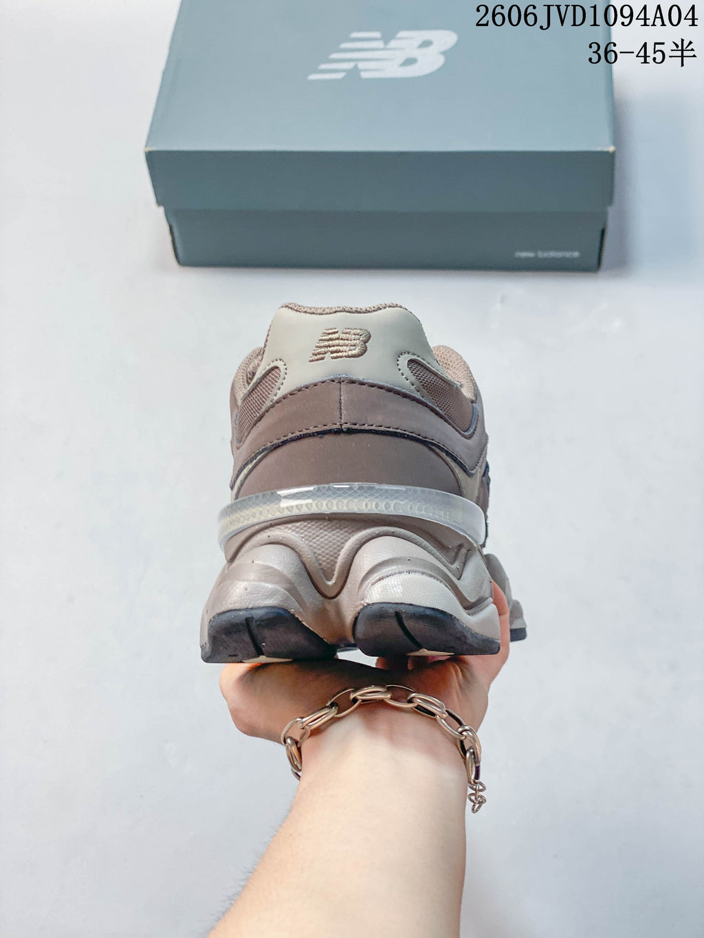 Rear view showing the heel and sculpted sole of a taupe sneaker