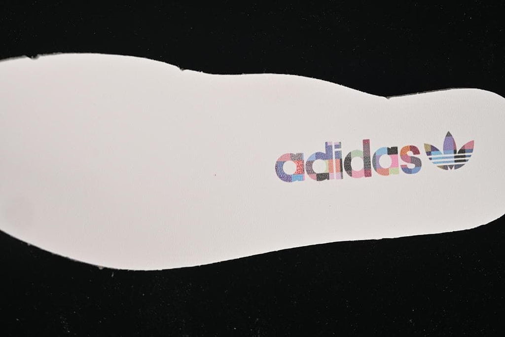 White insole with a multicolor adidas Trefoil logo