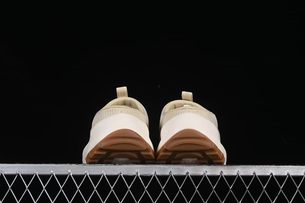Rear view of the pair showing heel openings and brown outsoles.