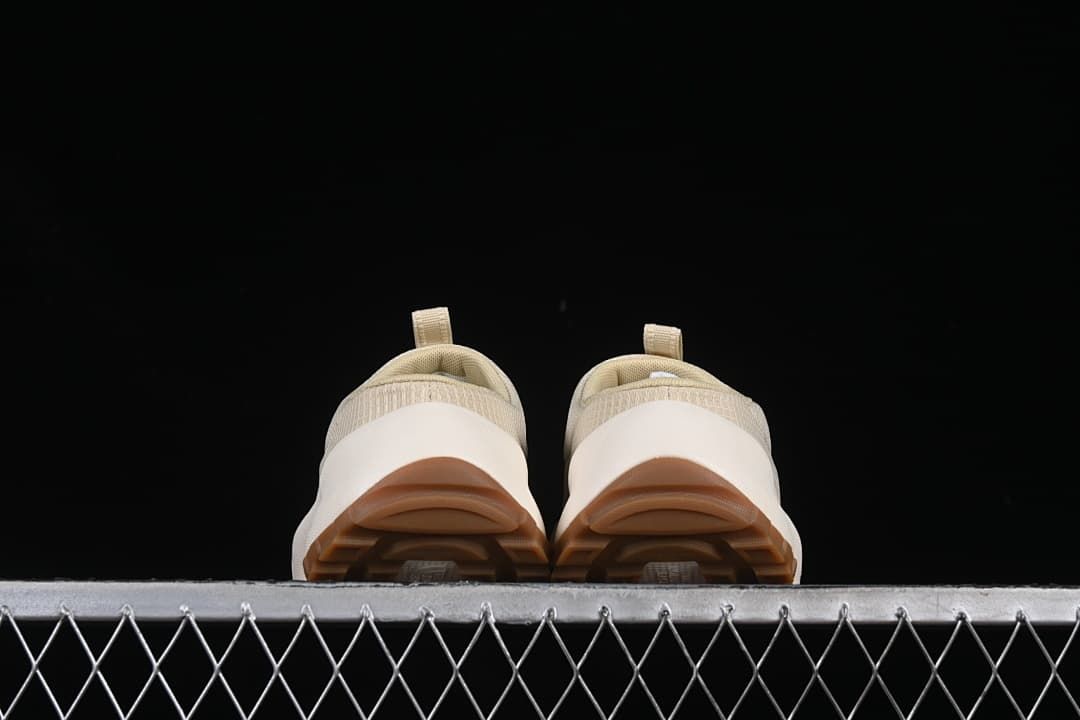 Rear view of the pair showing heel openings and brown outsoles.