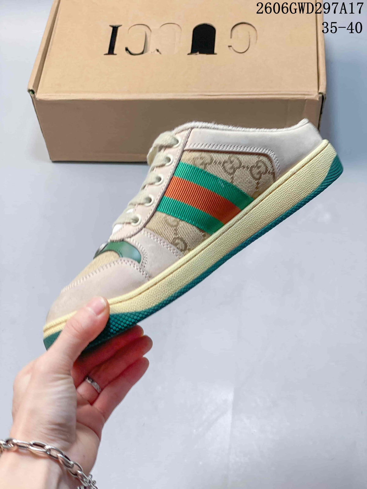 Side view of the patterned lace-up mule sneaker with green and red stripes